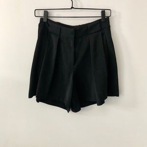 Black pleated shorts